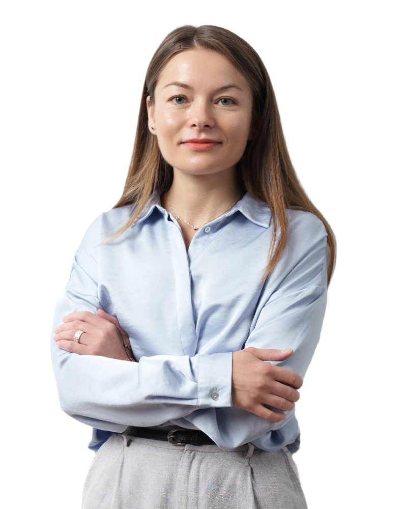 Confident businesswoman in casual attire, posing with a professional look.
