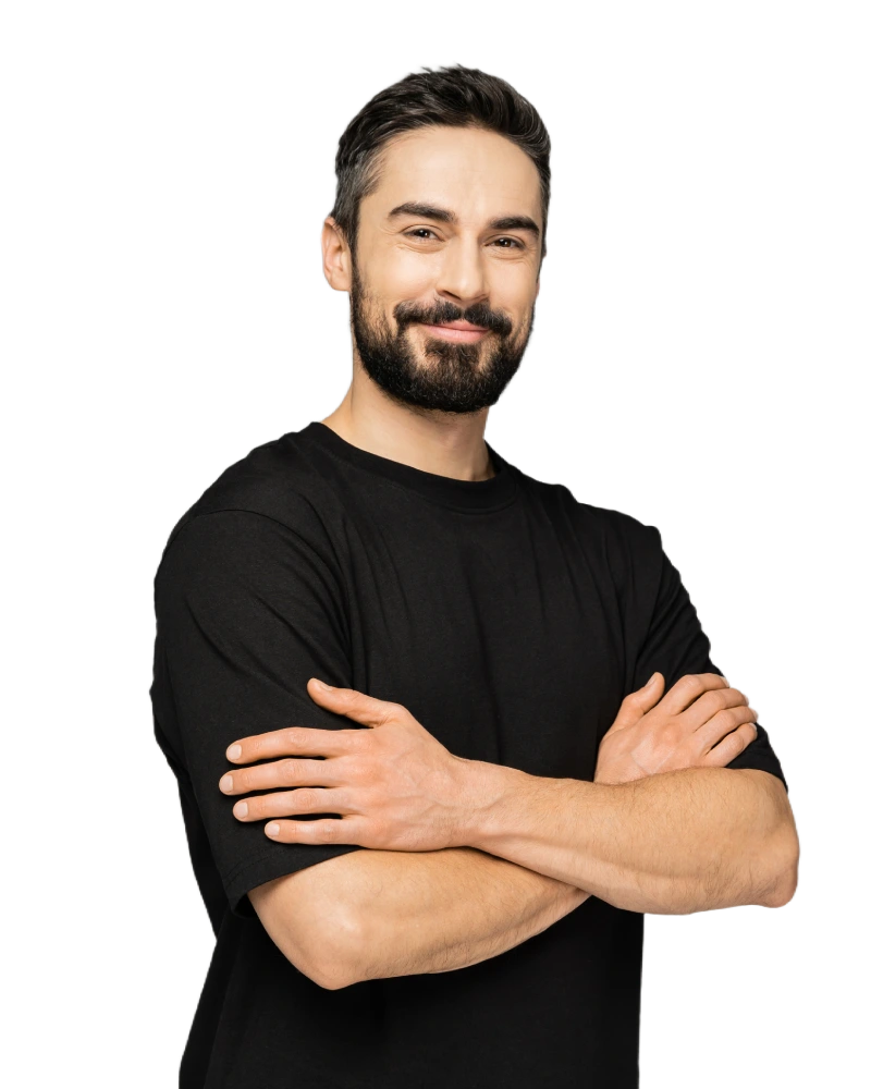 Smiling brunette woman and bearded man in casual black outfits standing together.
